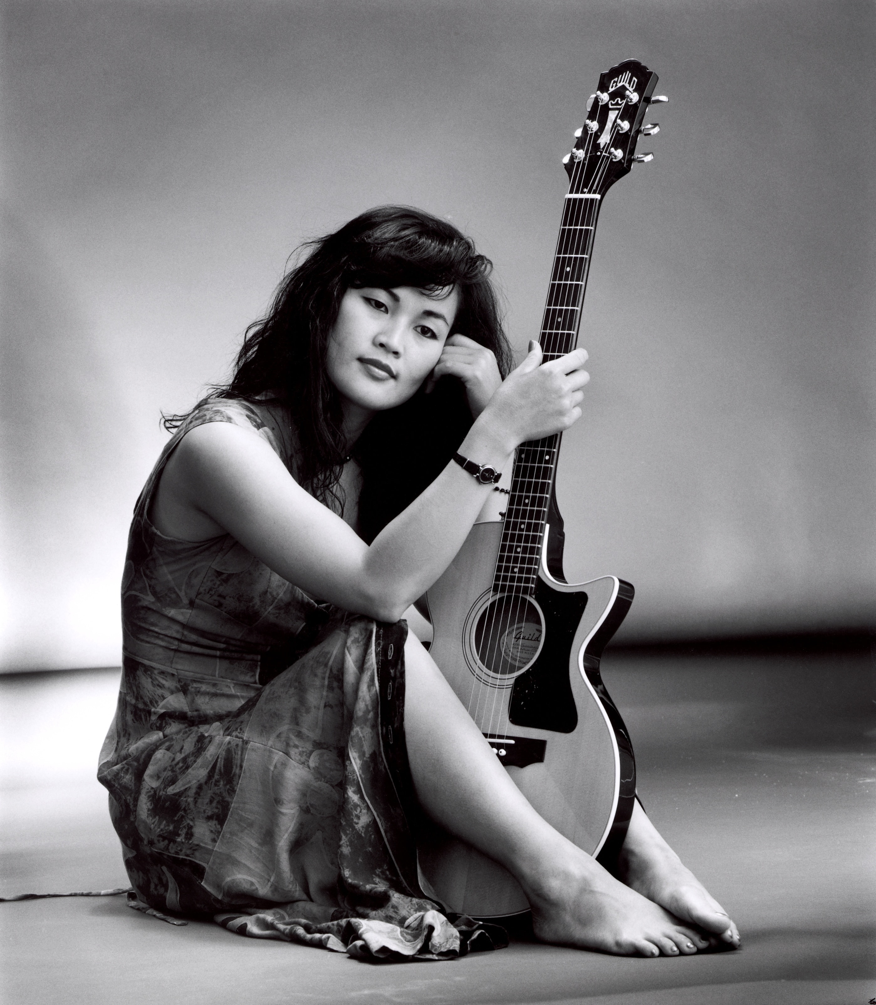 Studio portrait with guitar